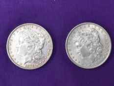 Two USA Morgan Dollars both nearly unused. A 1879 Morgan Dollar San Francisco Mint Mark, A 1884