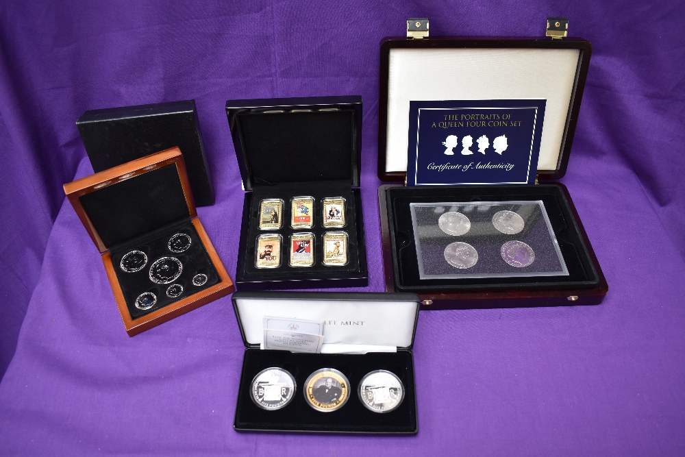 Four boxed Coin Sets, Jubilee Mint Churchill and 2 Queen Elizabeth II £5 Coins, 6 WW1 Poster Ingots,