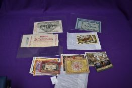 An album and loose of 1920's Notgeld Notes, approx 20 pages containing approx 100 notes, appear