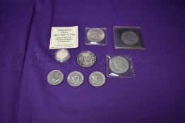 A collection of world Coins including a USA 1972 Dollar, three 1974 Half Dollars, a Cuba 1853-1953