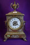 A heavy set continental brass bracket clock having enamel dial chime and extensive ormolu