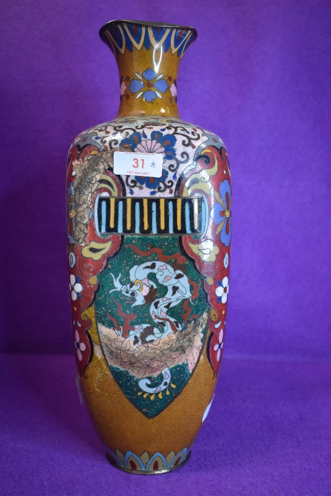 An oriental cloisonne vase having pheonic and dragon decoration having one side badly damaged