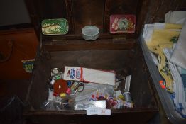 A vintage wooden chest containing an assortment of Haberdashery.