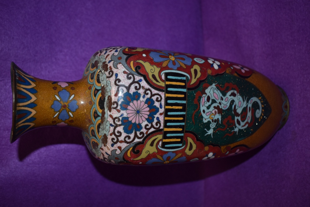 An oriental cloisonne vase having pheonic and dragon decoration having one side badly damaged - Image 4 of 7