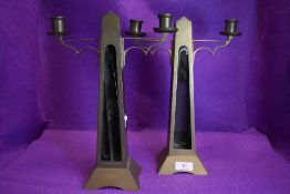 A pair of antique brass candle stick holder with glass inserts to front(currently loose and will