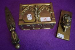 A selection of brass items including letter opener and jewellery box with Cornish Piskie to front.