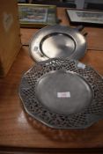 Two pewter plates one having pierced naturalistic decoration