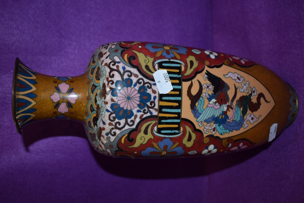 An oriental cloisonne vase having pheonic and dragon decoration having one side badly damaged - Image 3 of 7