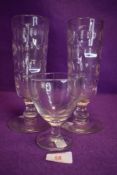 A collection of three antique glasses.