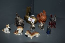 A mixed collection of dog and rabbit figures including glass, ceramic and metal amongst which are
