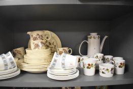 A large collection of mid century ceramics including cups and saucers, plates , coffee pot and more