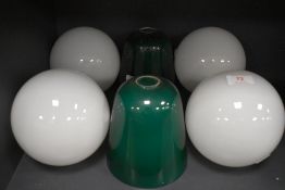 Six vintage lamp shades, four in white glass and two green.