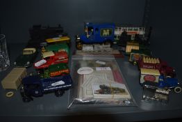 A quantity of Lledo advertising model vans, model cars and trains also, cigarette cards amongst this