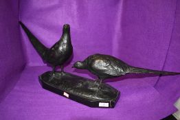 An impressive original German bronze figure depicting a pair of pheasants, mounted on marble or