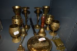 A mixture of brass including snuffer and candle stick holders.