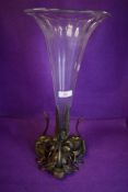 A large antique glass and brass centre piece or vase of trumpet shape having brass goose and
