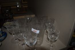 A selection of antique etched and cut beakers and wine glass