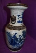 A large standing Chinese export porcelain vase possibly depicting the eight immortals or similar