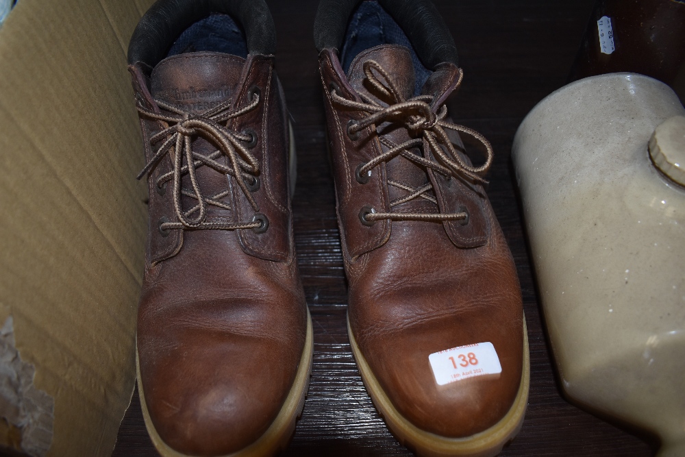 A pair of modern brown leather Timberland boots or shoes as new size 11