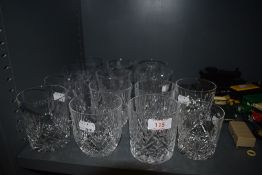 A collection of cut glass and similar tumblers.