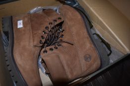 A pair of as new in box boots by Timberland in a brown tan leather size uk 10.5