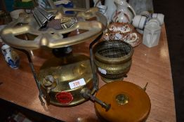 A vintage British made brass Paraffin stove, a rose bowl and a tape measure.