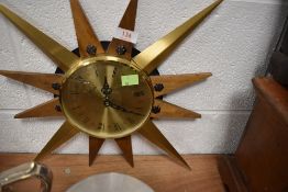 A mid century star burst design wall clock by Timemaster