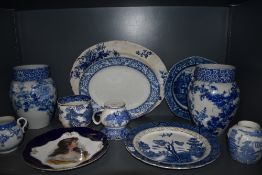 An array of blue and white ware including platters, Davenport mug, plates and more.