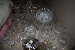 A selection of clear cut and crystal glass wares including tumblers and fruit bowls