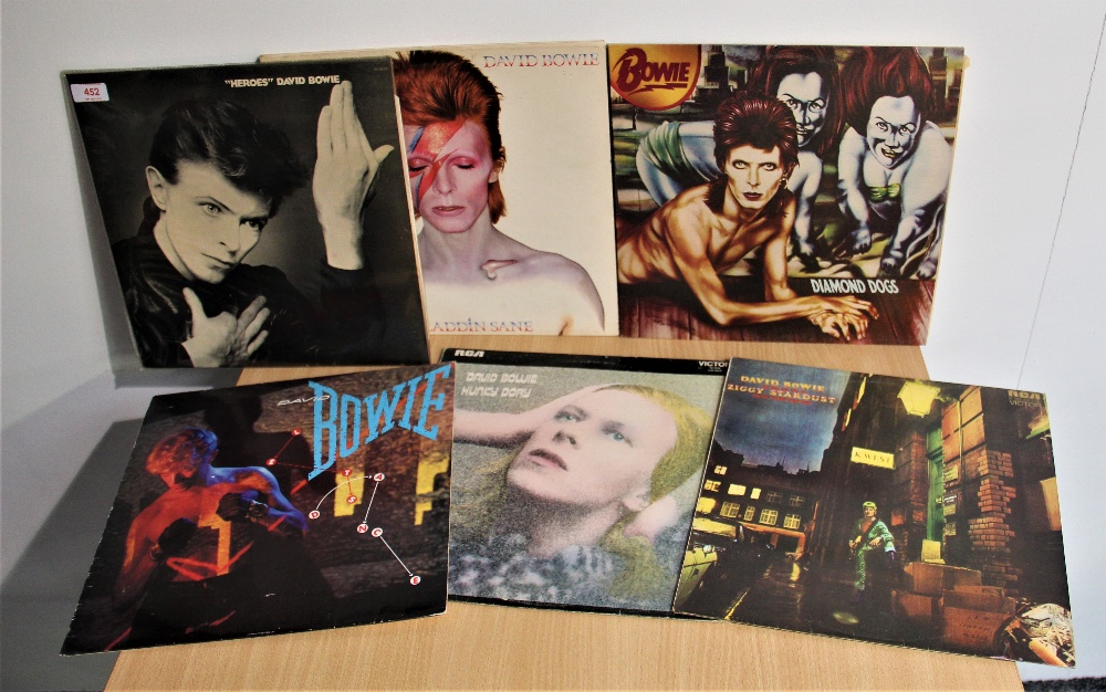 A lot of Seven David Bowie albums with relevant inners - all in good playing condition