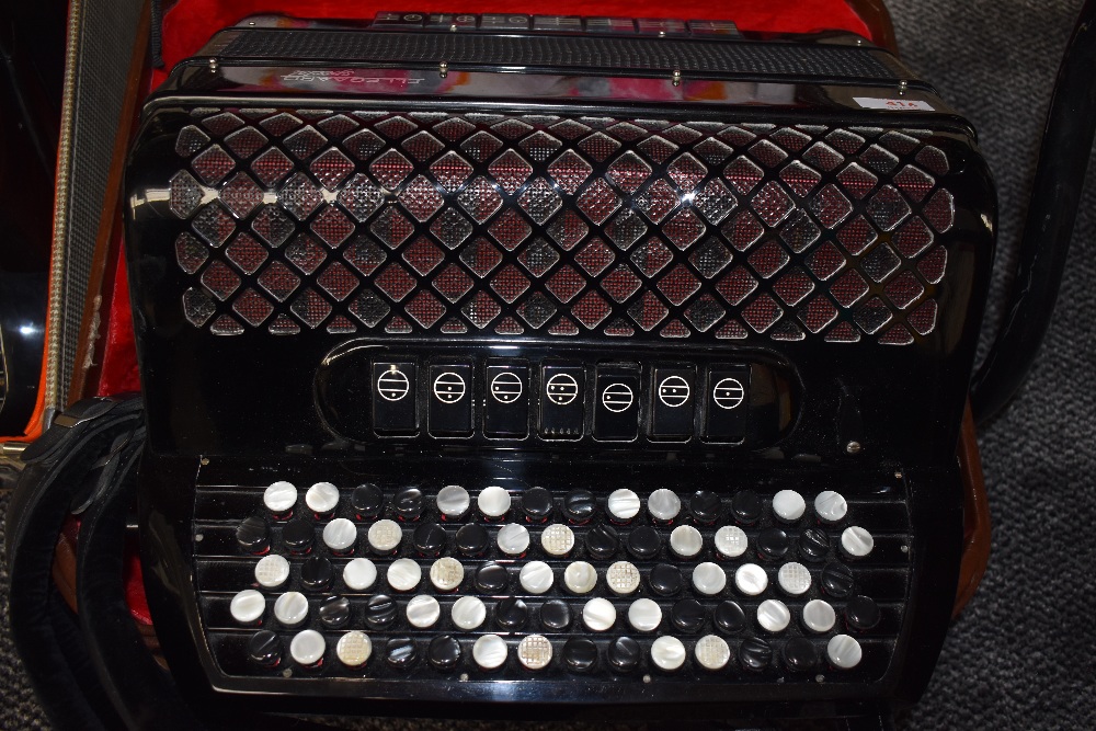 An Ellegaard Special button accordion, with plush lined case, in very clean condition