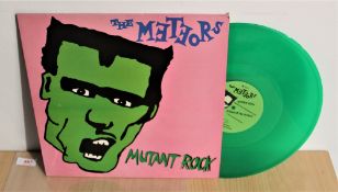 A copy of the Meteors ' Mutant Rock ' ep on green vinyl - punk / rockabilly interest