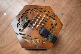 A traditional 48 button concertina, labelled Lachenal, on cloth interior , probaby late 19th/early