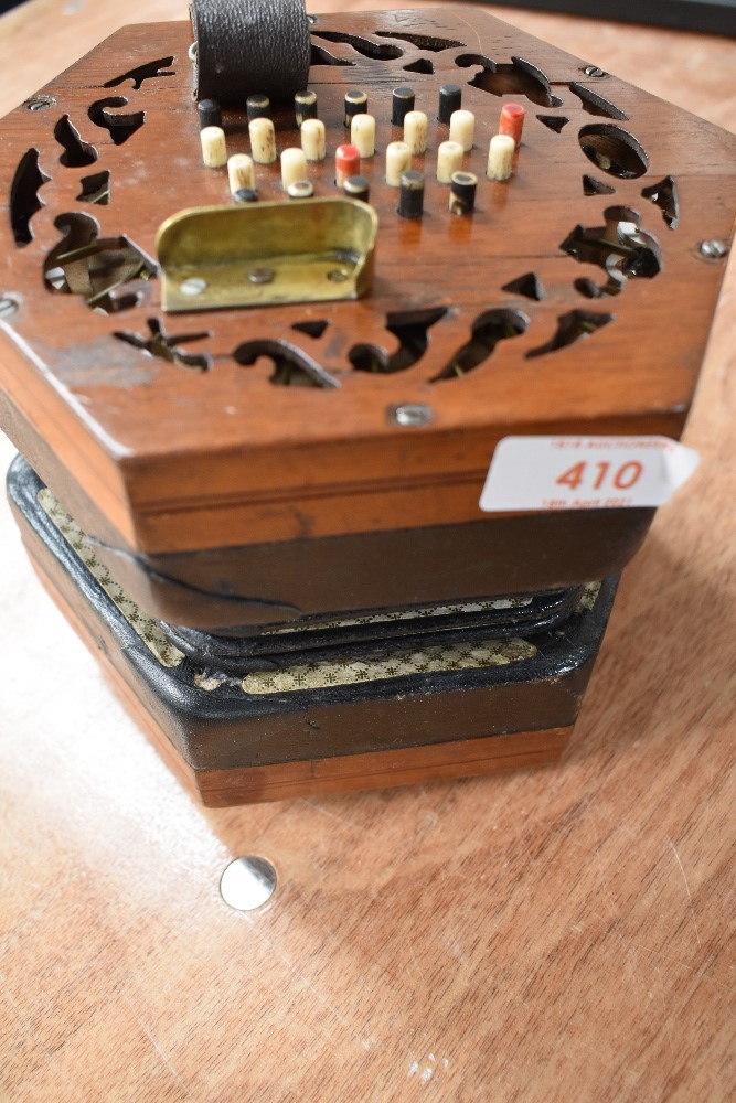 A traditional 48 button concertina, probably Lachenal late 19th/early 20th Century, some splitting