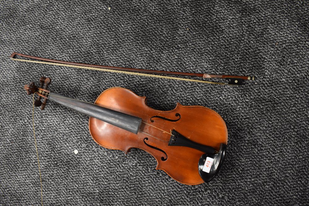 A French Violin, labelled Louis Cherpitel, having two piece 14in (36cm) back, in hard case with