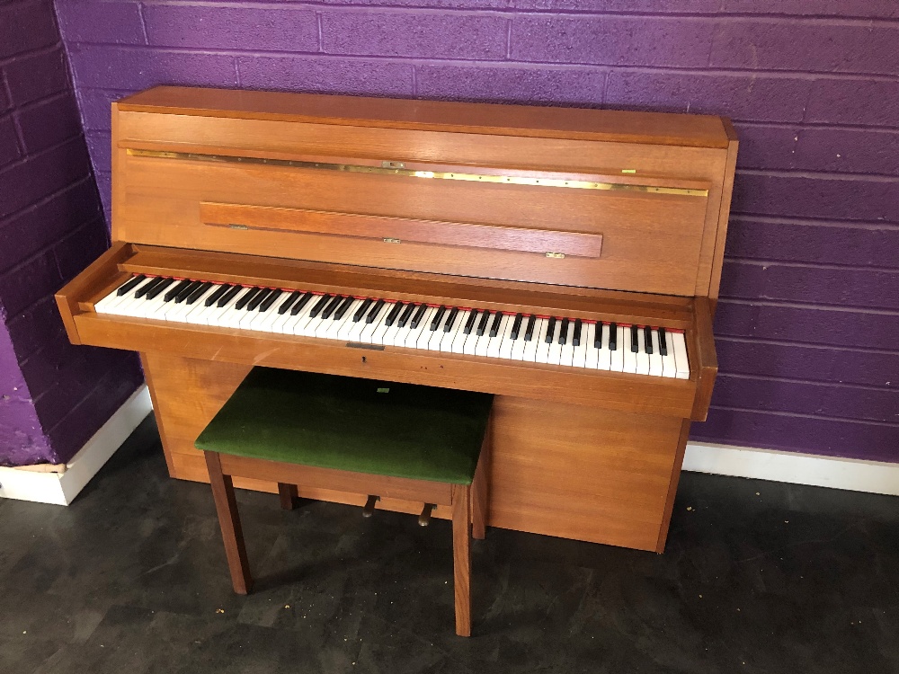 A vintage upright piano, labelled Duck Son & Pinker Ltd and Mahler