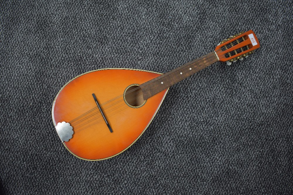 A vintage sunburst flat back (slight bowl) mandolin , not labelled, with soft bag