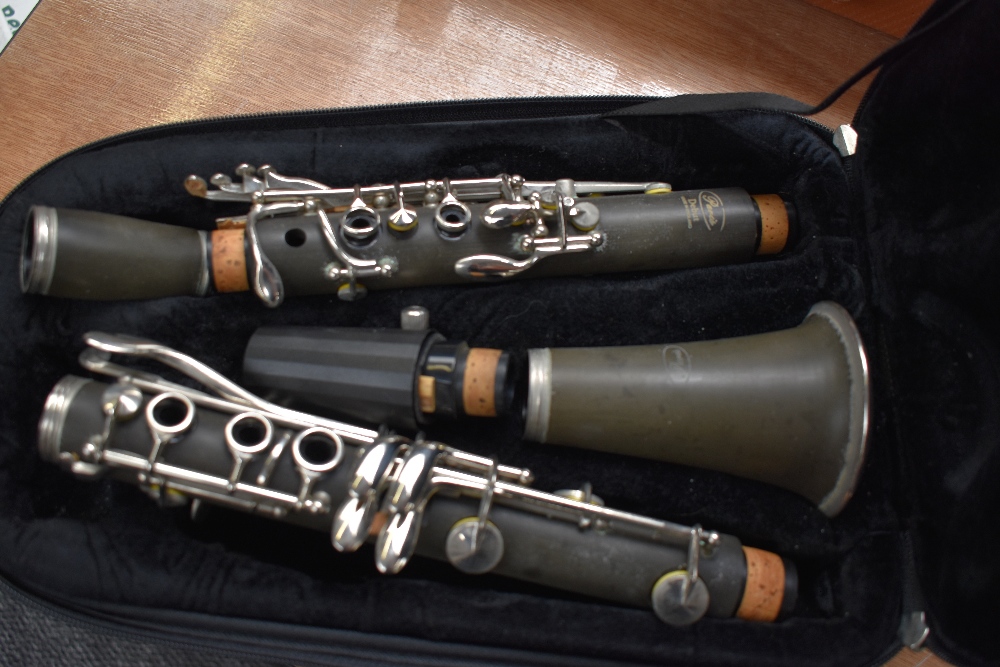 A Paris Debut clarinet, impressed serial number K3127, in back pack style case