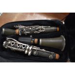 A Paris Debut clarinet, impressed serial number K3127, in back pack style case