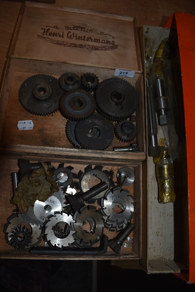 A selection of machine workshop boring bits and similar gear cogs and wheels