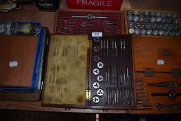 A selection of tap and dye machinist screw treading tools and similar