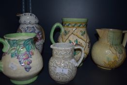 A collection of vintage Bursley ware and crown Ducal jugs including four of which are signed