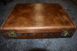 A leather bound briefcase having leather compartmented lining, Handle present but AF