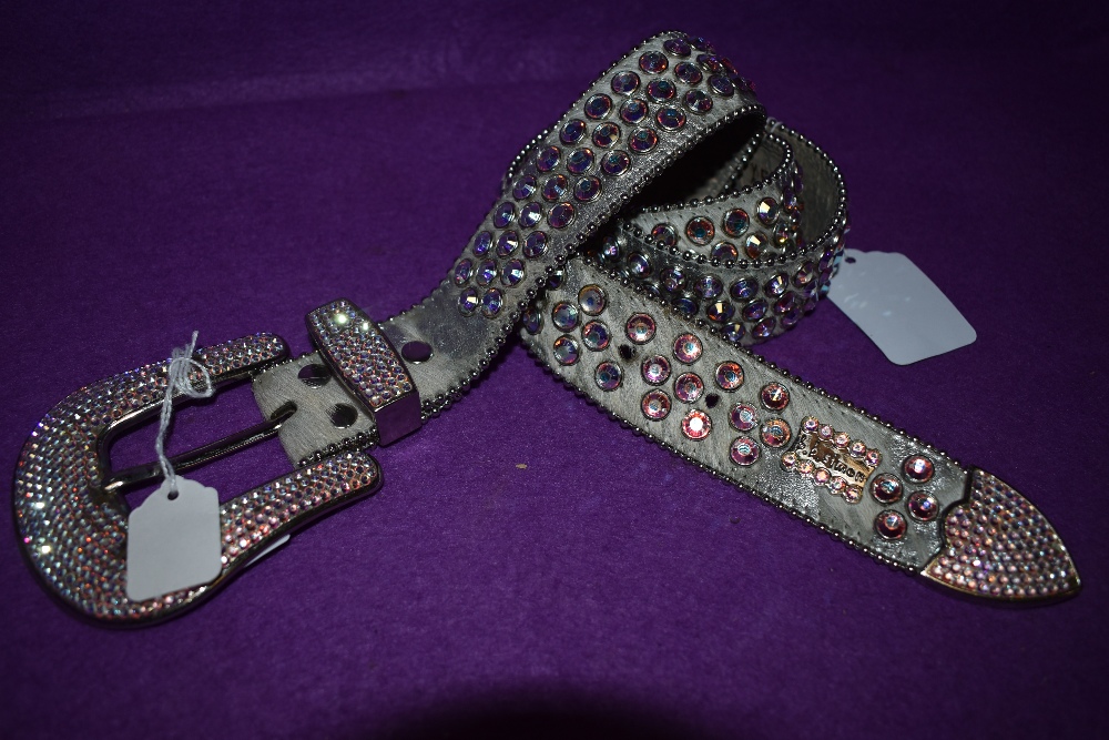 A highly collectable BB Simon studded belt in silver and pink tones.