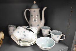 A collection of Susie Cooper 'one o'clocks' coffee service including coffee pot, cups and saucers