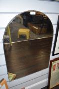 A vintage wood backed wall mirror.