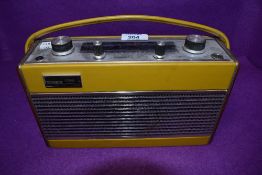 A vintage mid century mustard yellow radio by Roberts