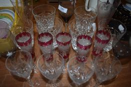 A collection of vintage glass including coloured and etched examples.