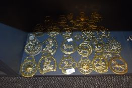 A large quantity of horse brasses in various styles and sizes.