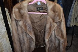 A vintage blonde mink short jacket,soft and supple and in a smaller size.